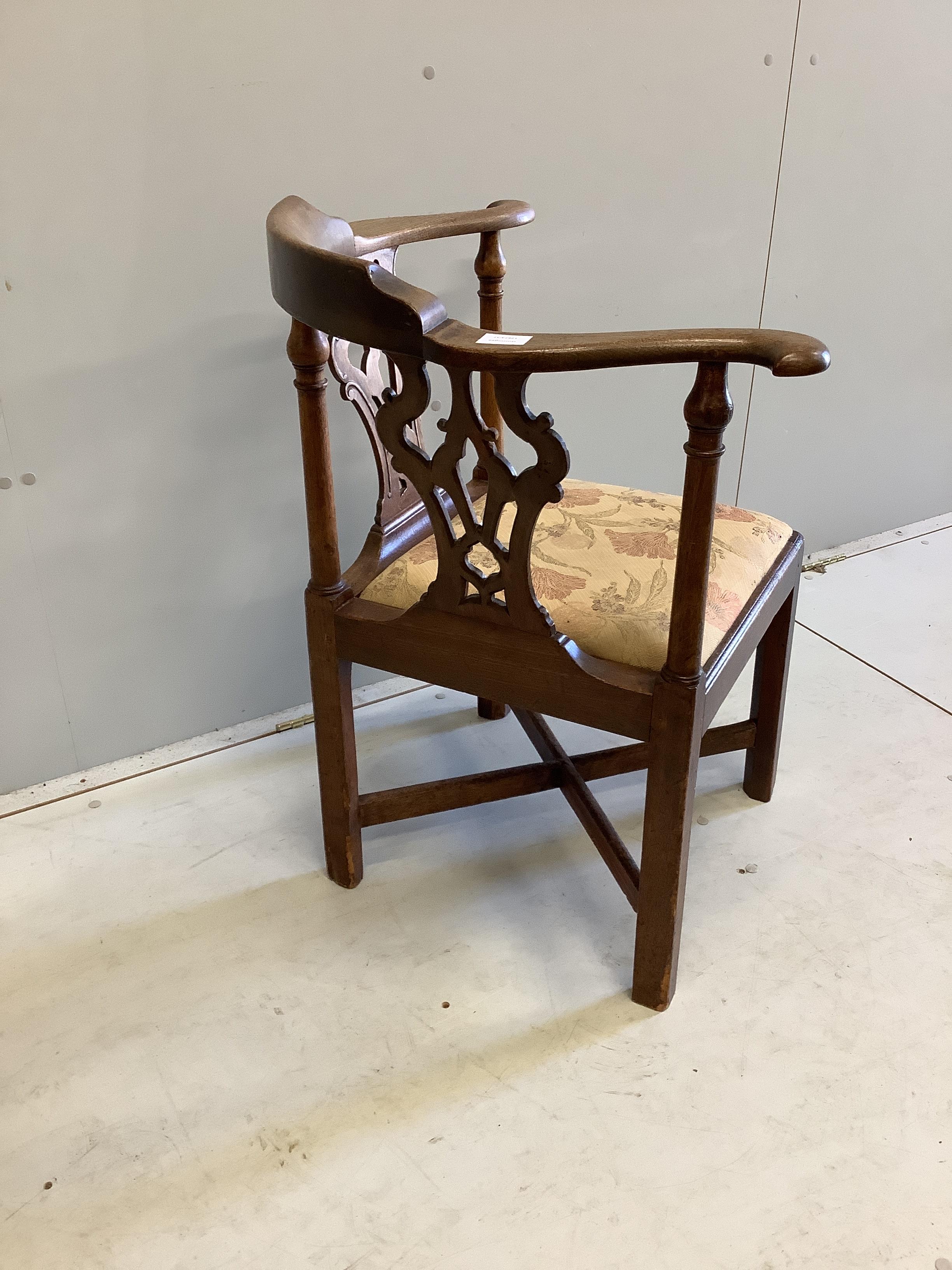 A George III mahogany corner elbow chair, width 73cm, depth 61cm, height 80cm